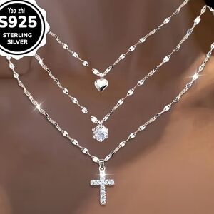 Sterling Silver Layered Necklace with Heart, Crystal, and Cross Pendants